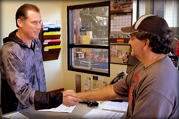Andy Germ Shaking Hands with a Client